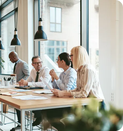 Business professionals discussing AI solutions in open office space area